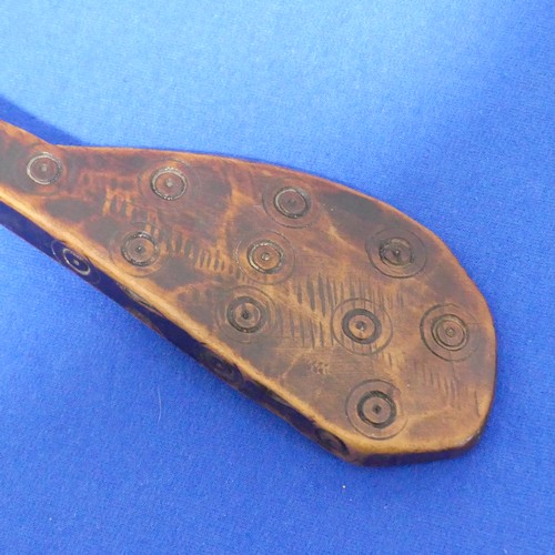 422 - An antique Tribal carved wooden Spoon or Scoop, probably African, carved with geometric circles and ... 