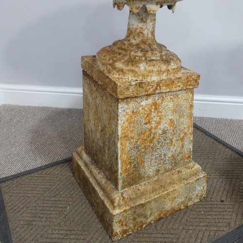 274 - A pair of antique cast iron Garden Urns and Stands, of fluted pedestal form with stiff leaf rim, eac... 