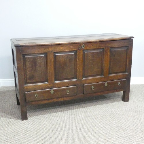 431 - A George III oak Mule Chest, with hinged lid, above four panel front, over two drawers, on square le... 