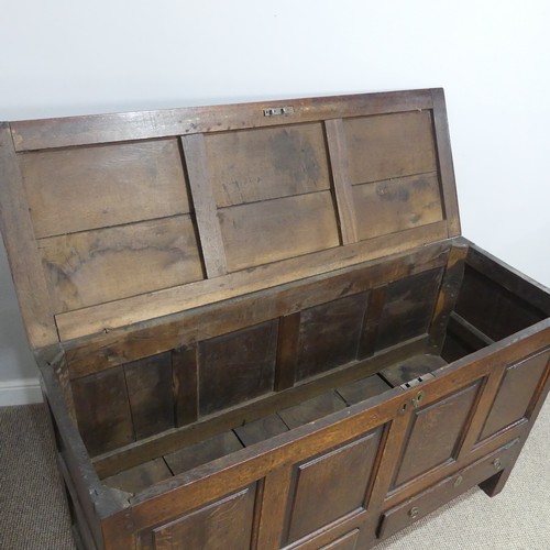 431 - A George III oak Mule Chest, with hinged lid, above four panel front, over two drawers, on square le... 