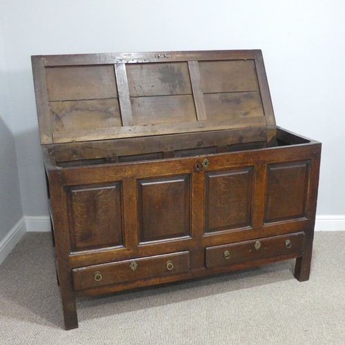 431 - A George III oak Mule Chest, with hinged lid, above four panel front, over two drawers, on square le... 