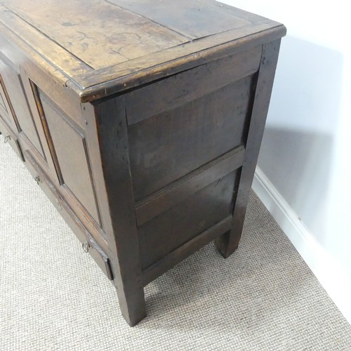 431 - A George III oak Mule Chest, with hinged lid, above four panel front, over two drawers, on square le... 