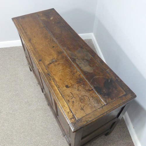 431 - A George III oak Mule Chest, with hinged lid, above four panel front, over two drawers, on square le... 