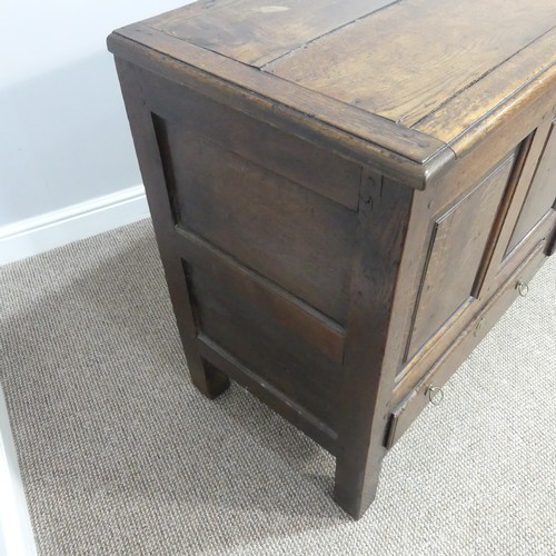 431 - A George III oak Mule Chest, with hinged lid, above four panel front, over two drawers, on square le... 