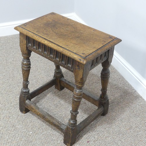 432 - An antique oak joint Stool, the rectangular seat with moulded edges, above a carved frieze, raised o... 