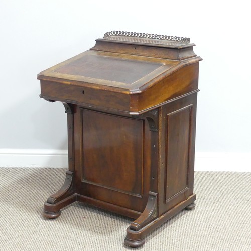 434 - A Victorian walnut Davenport, the rectangular top with galleried stationery compartment, lifting to ... 