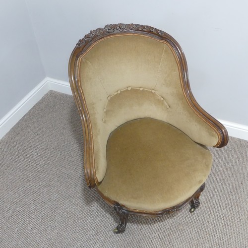 437 - A French Empire style upholstered Tub Chair, with carved floral detail, upholstered in beige, on sha... 