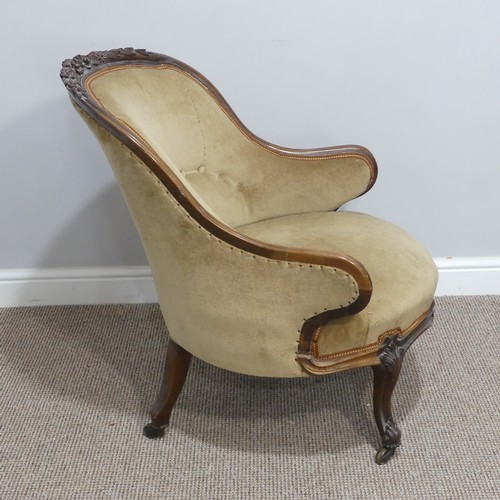 437 - A French Empire style upholstered Tub Chair, with carved floral detail, upholstered in beige, on sha... 