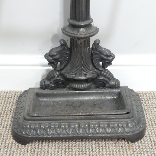 440 - A Victorian-style cast iron Stick Stand, the central column flanked by lions beneath a laurel encrus... 