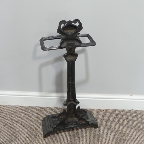 440 - A Victorian-style cast iron Stick Stand, the central column flanked by lions beneath a laurel encrus... 