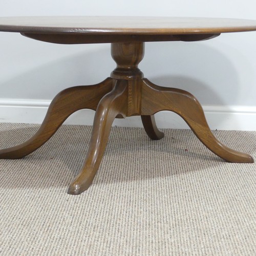 442 - An Ercol oval 'Chester' Coffee Table, on four splayed base, with metal and paper makers label to und... 