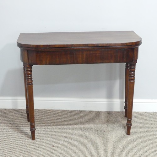 291 - A Georgian mahogany Card Table, the fold-over top revealing circular green baize inset, raised upon ... 