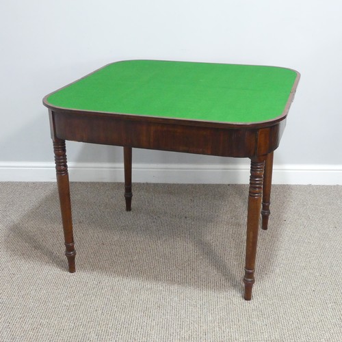 291 - A Georgian mahogany Card Table, the fold-over top revealing circular green baize inset, raised upon ... 