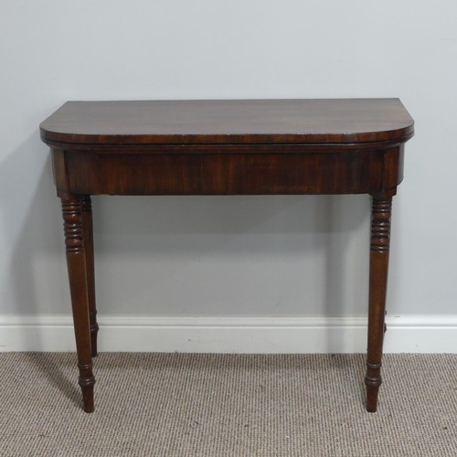 291 - A Georgian mahogany Card Table, the fold-over top revealing circular green baize inset, raised upon ... 