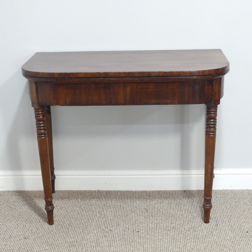 291 - A Georgian mahogany Card Table, the fold-over top revealing circular green baize inset, raised upon ... 