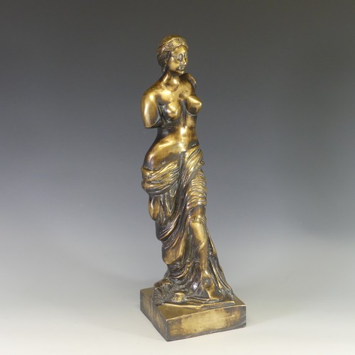 242 - A gilt brass figure of Venus De Milo, modelled after the antique, raised on an integral plinth, H 48... 