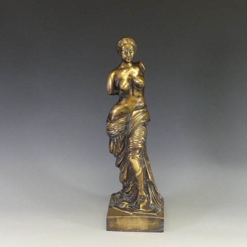 242 - A gilt brass figure of Venus De Milo, modelled after the antique, raised on an integral plinth, H 48... 