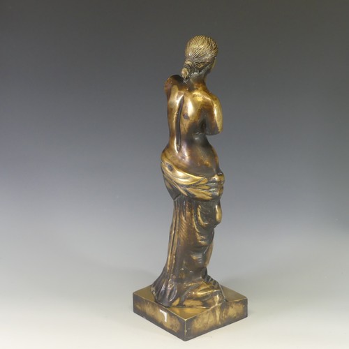 242 - A gilt brass figure of Venus De Milo, modelled after the antique, raised on an integral plinth, H 48... 