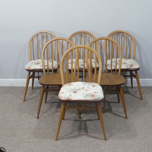 455 - A set of six vintage Ercol hoop back Dining Chairs, with upholstered cushions, stamped to the unders... 