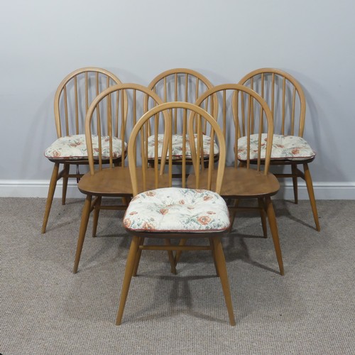 455 - A set of six vintage Ercol hoop back Dining Chairs, with upholstered cushions, stamped to the unders... 