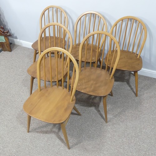 455 - A set of six vintage Ercol hoop back Dining Chairs, with upholstered cushions, stamped to the unders... 