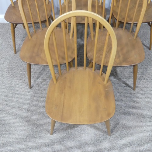 455 - A set of six vintage Ercol hoop back Dining Chairs, with upholstered cushions, stamped to the unders... 