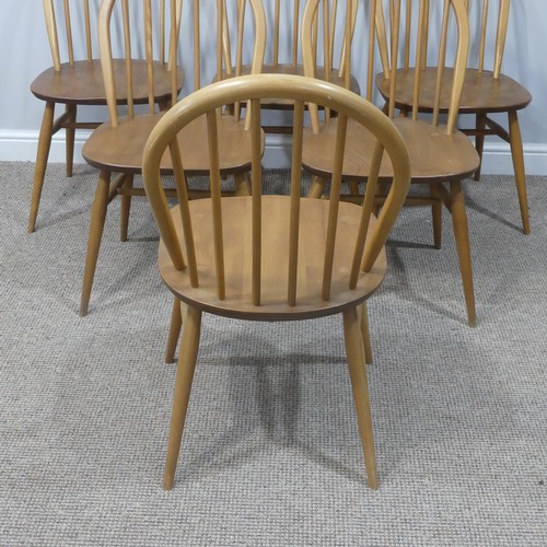 455 - A set of six vintage Ercol hoop back Dining Chairs, with upholstered cushions, stamped to the unders... 