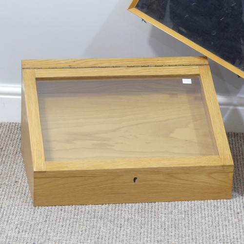 456 - A pair of oak table-top Display Cabinets, of sloped form with glazed hinged lid, W 51cm x D 39cm x H... 