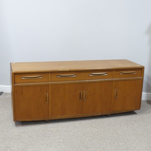 459 - A mid 20thC retro G Plan teak 'Fresco' low Sideboard, three drawers over four cupboards, on ball cas... 