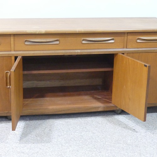 459 - A mid 20thC retro G Plan teak 'Fresco' low Sideboard, three drawers over four cupboards, on ball cas... 