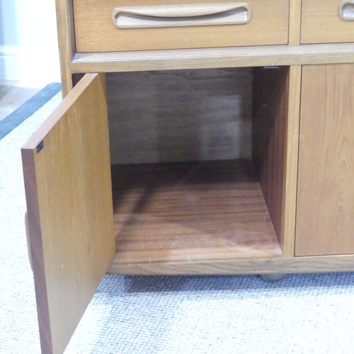 459 - A mid 20thC retro G Plan teak 'Fresco' low Sideboard, three drawers over four cupboards, on ball cas... 