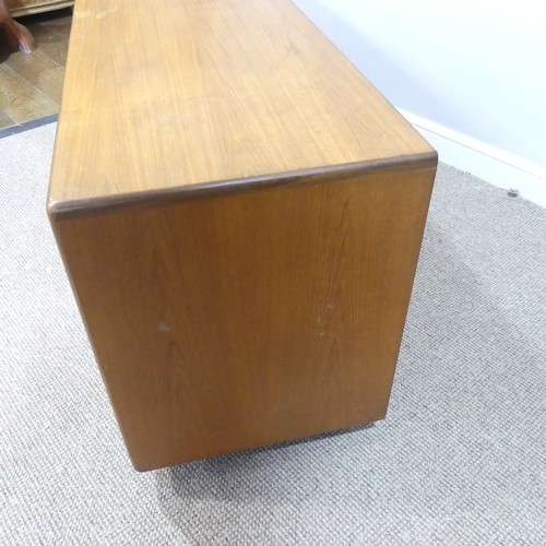 459 - A mid 20thC retro G Plan teak 'Fresco' low Sideboard, three drawers over four cupboards, on ball cas... 