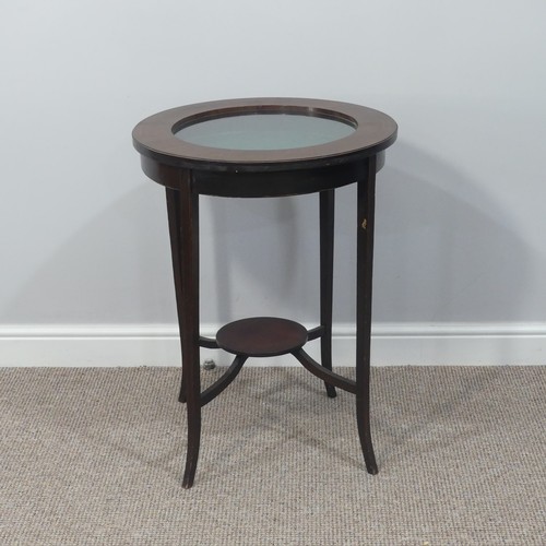 298 - An early 20thC inlaid mahogany circular Bijouterie Table, with circular glazed lift up top with gree... 