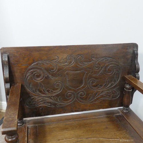 464 - A Victorian carved oak Monks Bench, of rectangular form, with typical hinged box seat base, and turn... 