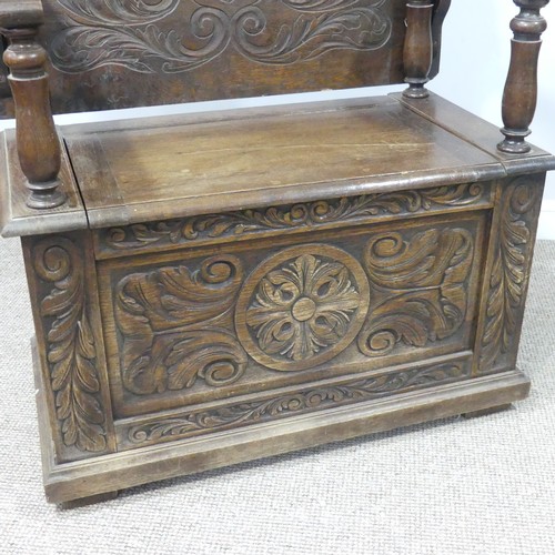 464 - A Victorian carved oak Monks Bench, of rectangular form, with typical hinged box seat base, and turn... 