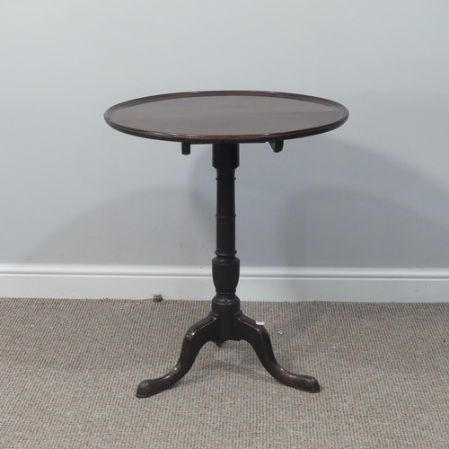 470 - A Georgian mahogany tilt-top Wine Table, with circular top, turned column and cabriole supports on p... 