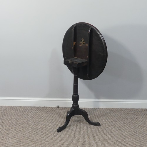 470 - A Georgian mahogany tilt-top Wine Table, with circular top, turned column and cabriole supports on p... 