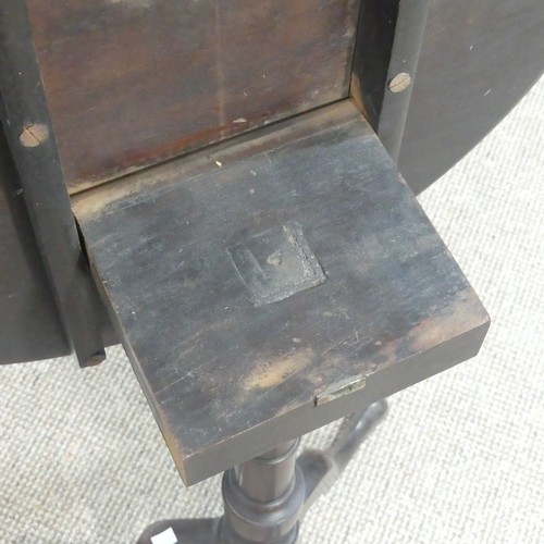 470 - A Georgian mahogany tilt-top Wine Table, with circular top, turned column and cabriole supports on p... 