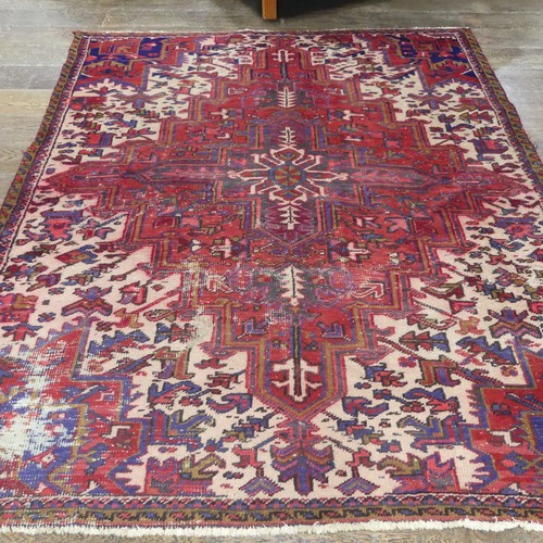 602 - Tribal Rugs; an old red ground Kazak wool on cotton carpet, pile very worn, 240cm x 200cm... 