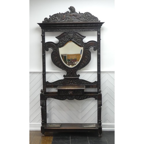 476 - A Victorian carved oak Jacobean Revival Hallstand, with shield shape mirror plate, single frieze dra... 