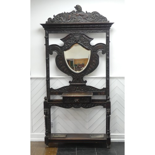 476 - A Victorian carved oak Jacobean Revival Hallstand, with shield shape mirror plate, single frieze dra... 