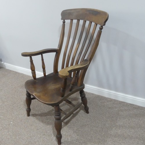 477 - A Victorian ash and elm open arm Windsor Chair, with slat back and solid seat on turned supports, W ... 