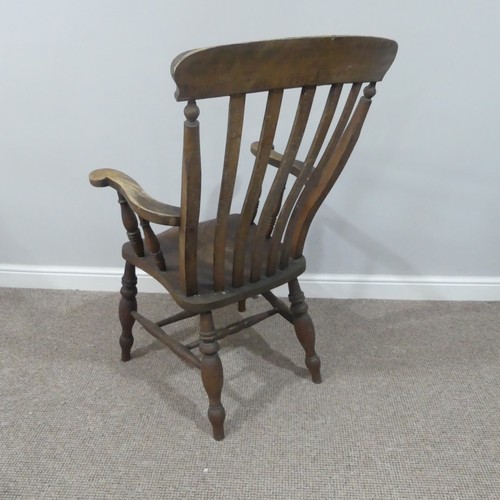 477 - A Victorian ash and elm open arm Windsor Chair, with slat back and solid seat on turned supports, W ... 