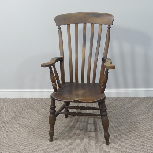 477 - A Victorian ash and elm open arm Windsor Chair, with slat back and solid seat on turned supports, W ... 