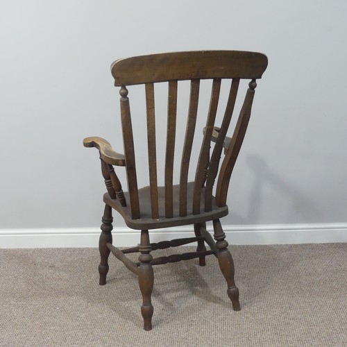 477 - A Victorian ash and elm open arm Windsor Chair, with slat back and solid seat on turned supports, W ... 