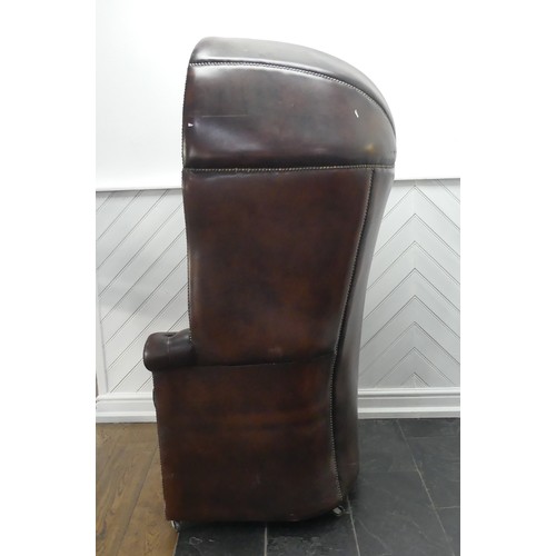 481 - A Georgian style button-back leatherette Hall Porter's Chair, with arched top and rounded seat, on c... 