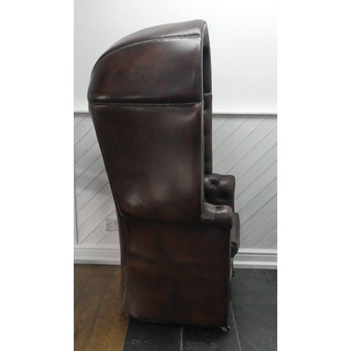 481 - A Georgian style button-back leatherette Hall Porter's Chair, with arched top and rounded seat, on c... 