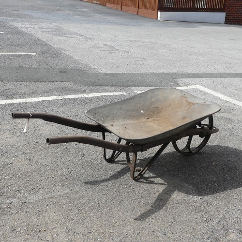 483 - An antique rustic metal Wheelbarrow, with spoked wheel and two handles, rusted and weathered, 155cm ... 