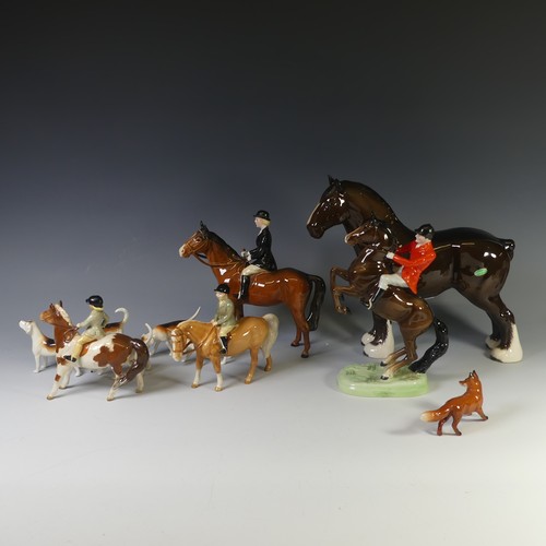 69 - A Beswick pottery Hunting Group, to include four Riders, one on Rearing Horse, one with Black Coat, ... 