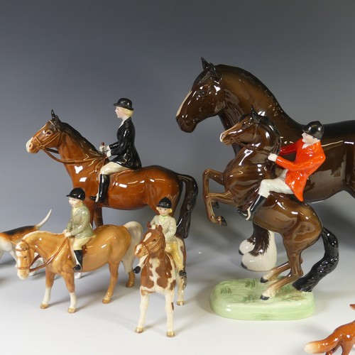 69 - A Beswick pottery Hunting Group, to include four Riders, one on Rearing Horse, one with Black Coat, ... 